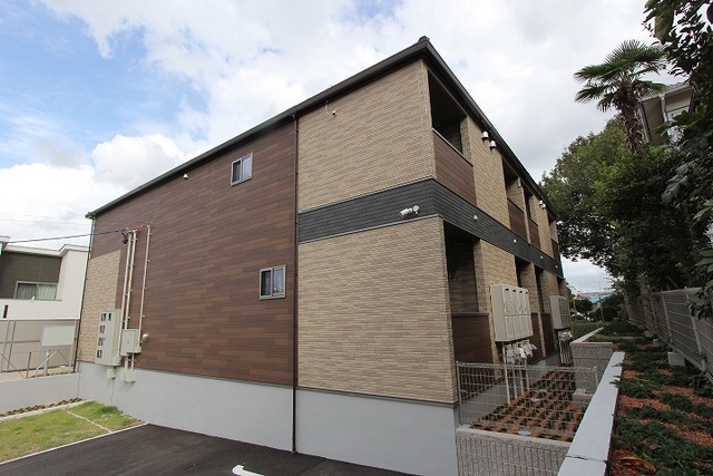 Fachada de プチメゾン松和花壇